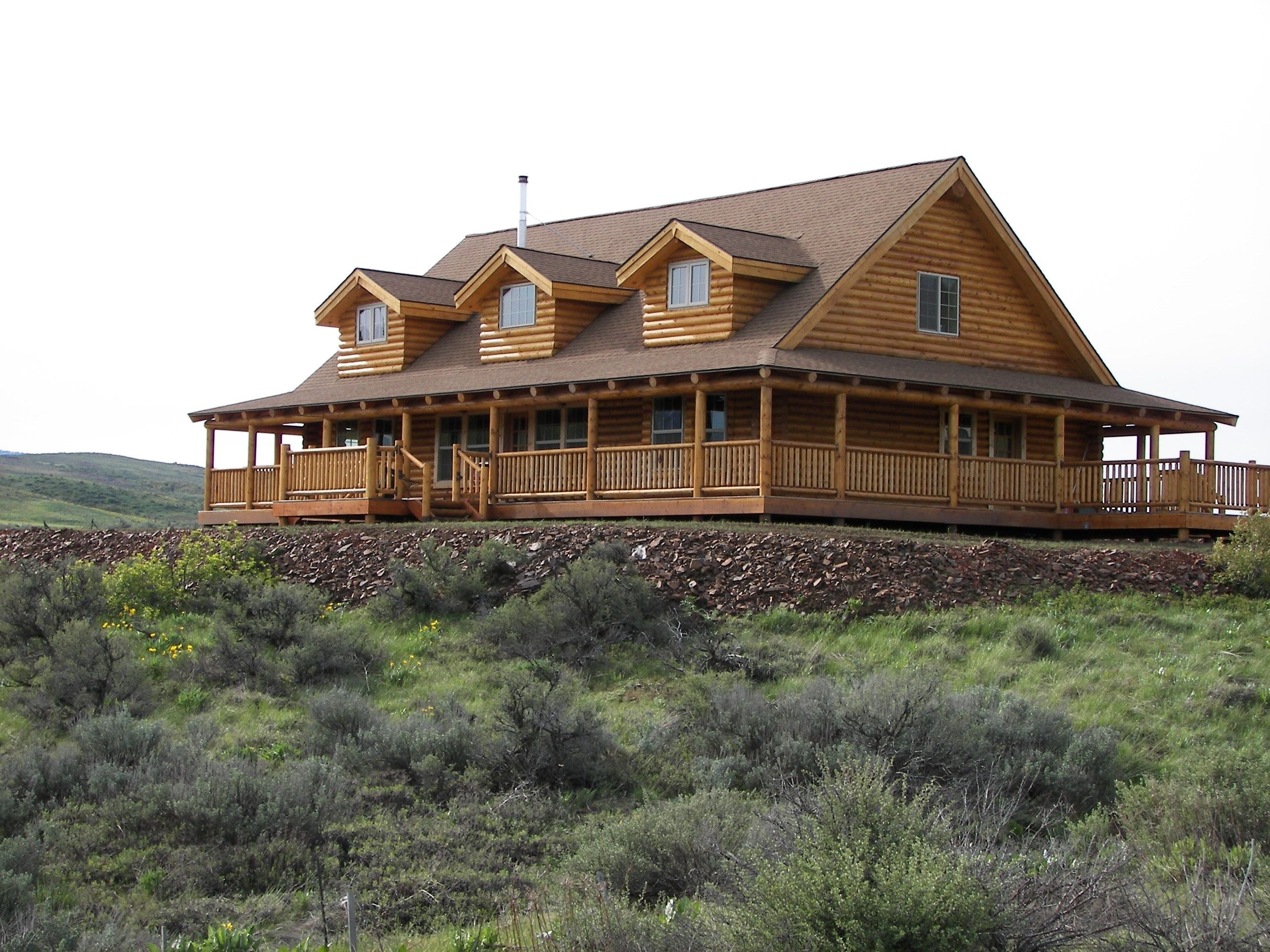 Two Story Log Cabin With Wrap Around Porch